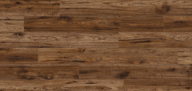 istock Brown laminate parquet floor planks with knots 2161336554