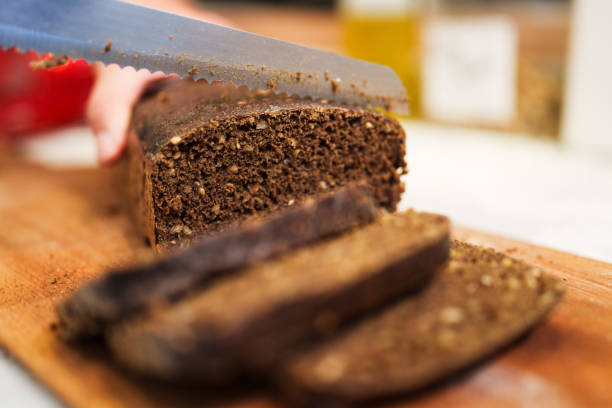 istock Slicing black bread at the bakery 2161339462