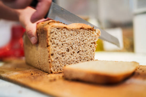 istock Slicing whole wheat bread at the bakery 2161339847