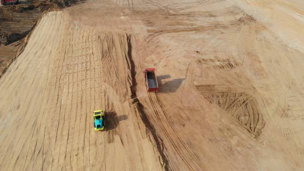 istock Drone view of bulldozers, excavators, and dump trucks involved in unsafe construction practices. Heavy machinery engaged in hazardous activities, without safety regulations and environmental standards 2161345277