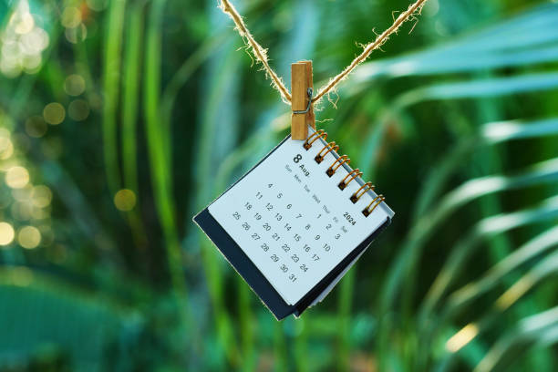 istock August 2024 calendar on rope with bokeh sunset nature background 2161345443