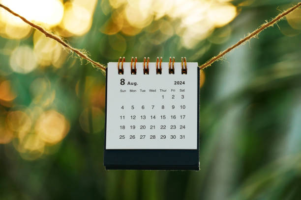 istock August 2024 calendar on rope with bokeh sunset nature background 2161345492