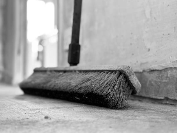 Close up of bristles on a hard floor sweeping brush