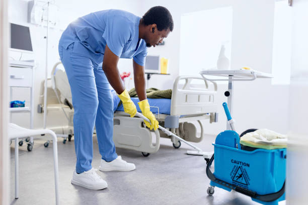 istock Black man cleaning hospital room 2161348777