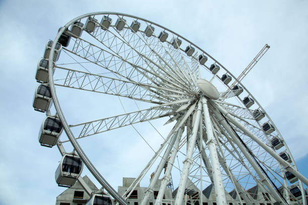 The view of a tall observation wheel at the entrance to Gdansk old town (Poland).