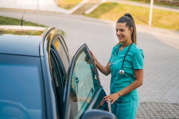 istock young female nurse get in car after work 2161351531