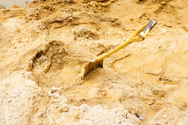Shovel in sand of construction site