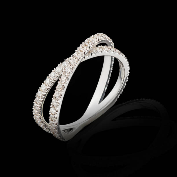 istock Beautiful white gold ring with diamonds on a black background close-up 2161354897