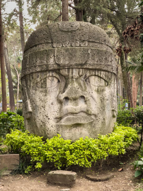 istock Ancient Colossus: Olmec Stone Head Stands Guard in Verdant Park. 2161354977