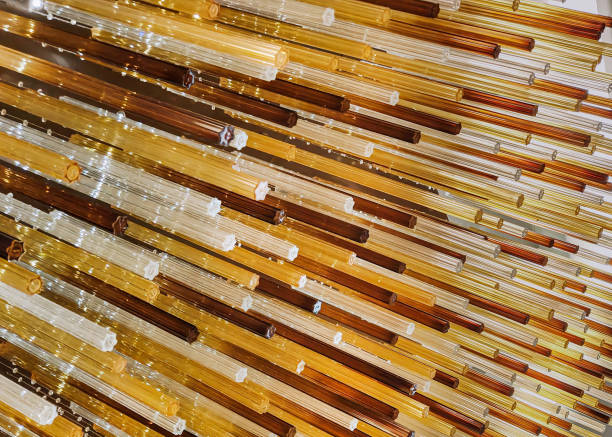 Close-up shot of Seamless Patterns Textured Glass with Yellow Hues . concept : Abstract yellow background,Seamless glass texture, Colorful glass art