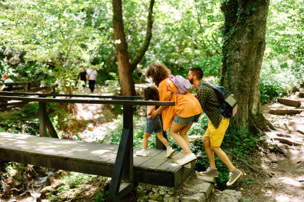 istock Little girl exploring nature with her parents 2161357218