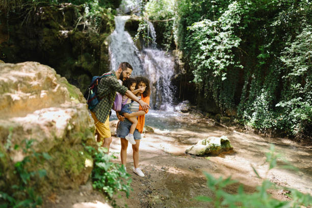 Caring father bonding with his family in nature