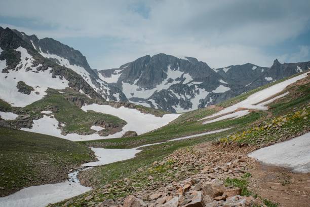 istock hiking to mountain in spring time 2161359465