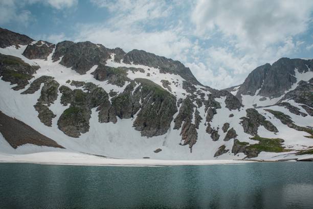 istock hiking to mountain in spring time 2161359822