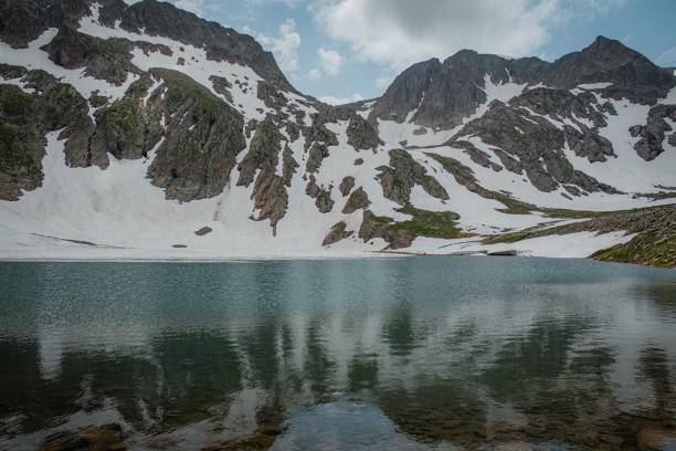 istock hiking to mountain in spring time 2161359825