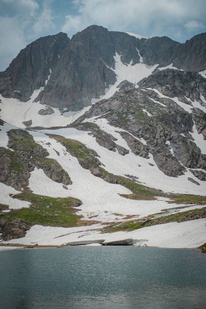 istock hiking to mountain in spring time 2161359830