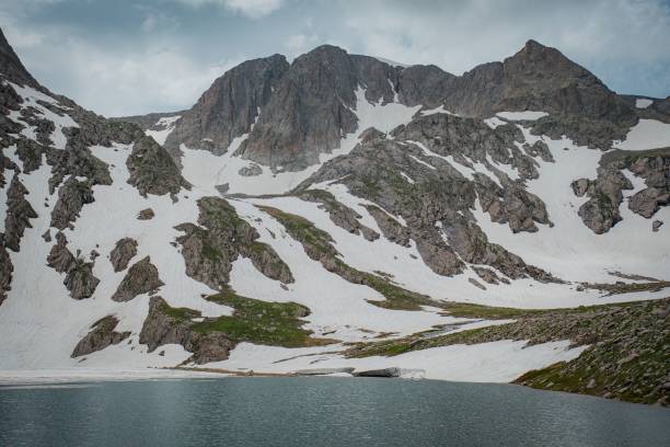 istock hiking to mountain in spring time 2161359832