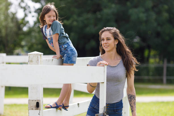 istock Mother and daughter at a ranch 2161363238