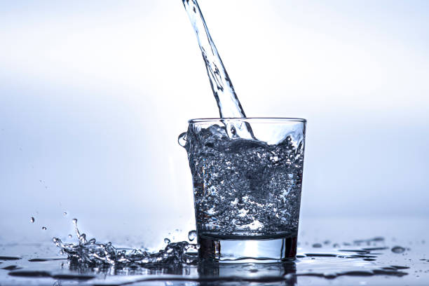 istock Spilling too much water into the glass 2161364732