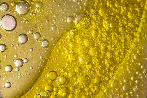 istock Drops of oil in a liquid 2161367125