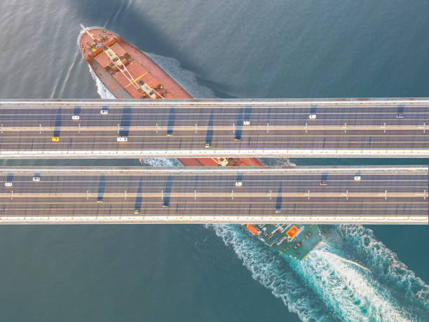 istock Cargo ship passing under bridge traffic at Istanbul Bosphorus 2161369048