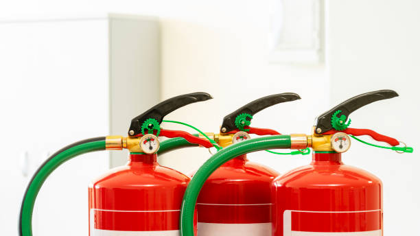 istock Close up of three chemical fire extinguishers. 2161370364