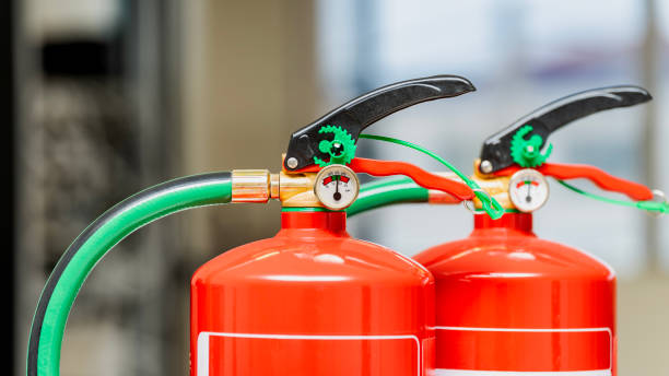 istock Close up of two chemical fire extinguishers. 2161370380