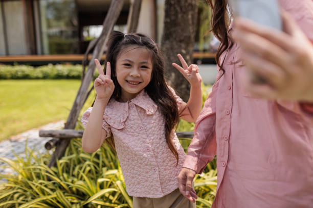 istock Cute girl having fun with mom 2161371074