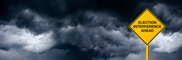 istock Election Interference  Ahead Road Sign in Front of Storm Clouds 2161372396
