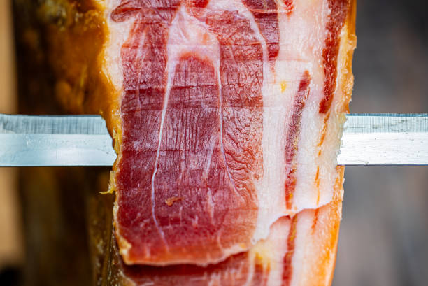istock Chef cutting dry-cured spanish ham Jamon. 2161374153