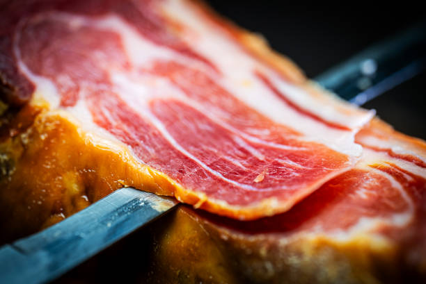 istock Chef cutting dry-cured spanish ham Jamon. 2161374352