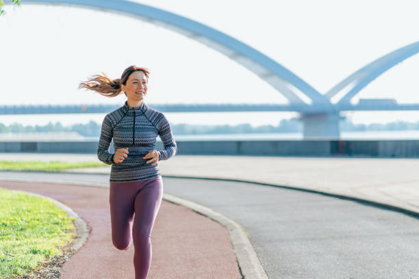 istock Happy sportswoman running 2161375222