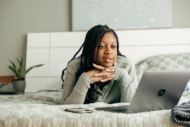 istock A teen setting savings goals using a budgeting app on a desktop computer 2161375569