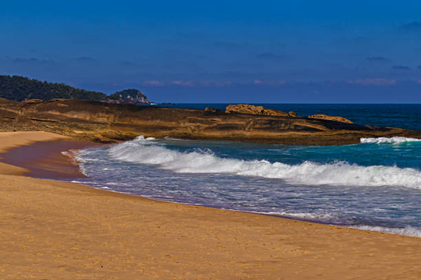 istock Waves breaking on the golden sands of De Fora beach. 2161380338
