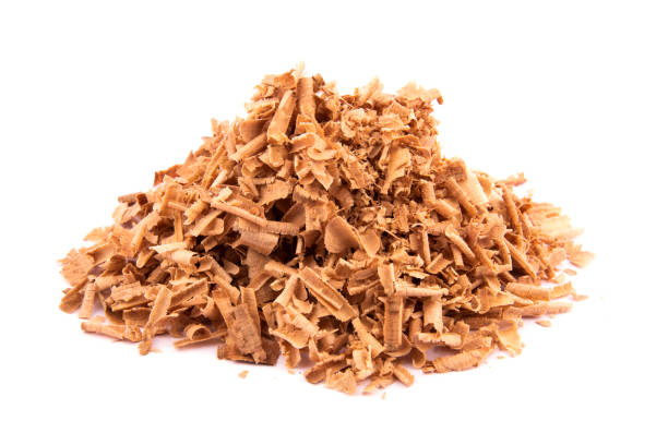 istock brown sawdust pile on white background. sawdust pile 2161382373