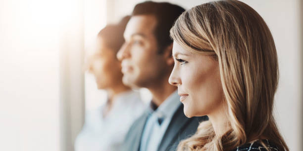 istock Office, teamwork and business people by window thinking for about us, collaboration and partnership. Corporate, diversity and row of men and women for professional career, company pride and ideas 2161385478