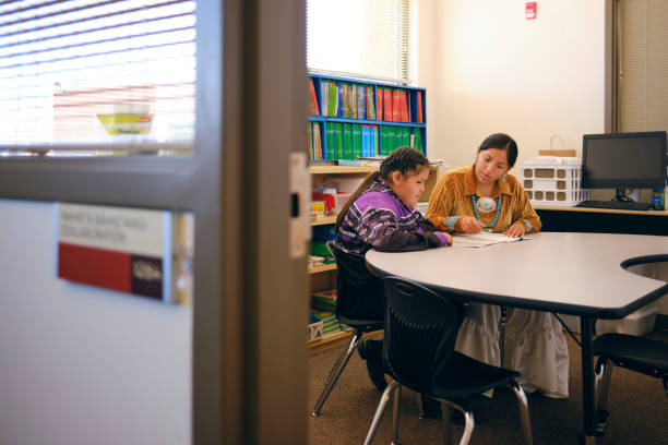 istock Student and Tutor in a School Building 2161386808
