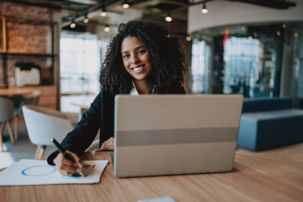 istock Young businesswoman using laptop at desk 2161387270