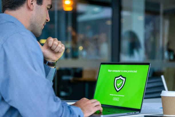 istock Businessman working and using antivirus software on a laptop. 2161394173