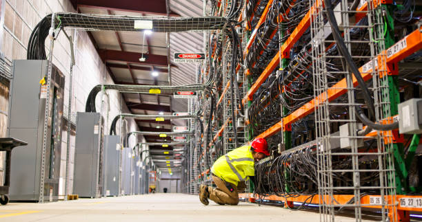 istock Wide Shot of Technician in Huge Data Center 2161394219