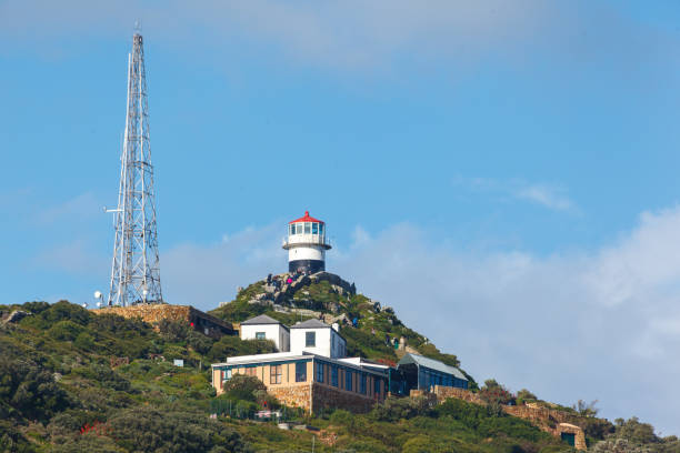 Scenic view of lighthouse against bush on the hill of Robben Island, Cape Town, South Africa