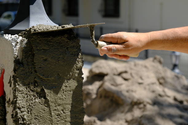 istock A construction worker is plastering a wall with a trowel 2161395865