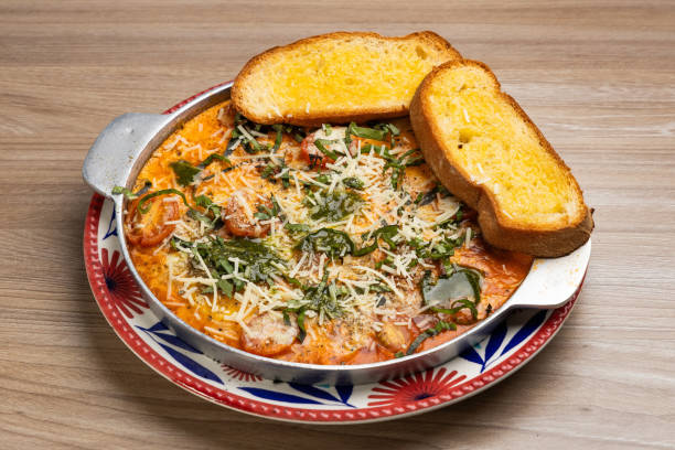 istock Breakfast with eggs, grated tomatoes, fresh basil and parmesan - Neapolitan eggs with toast 2161396345