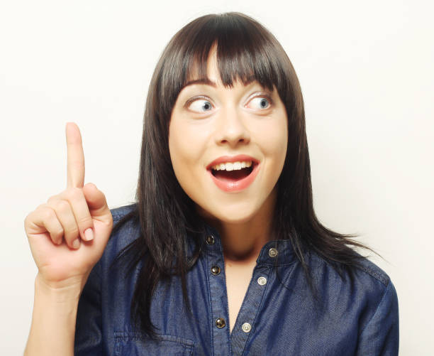 istock Young woman with her finger up. Good idea! 2161397017