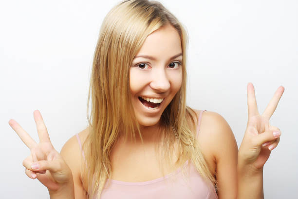 Close up portrait of young woman on green background