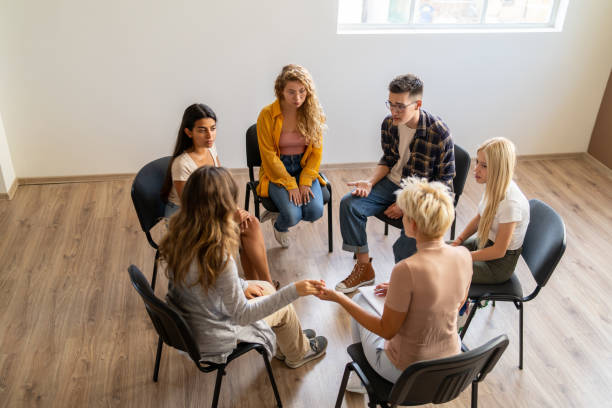 istock Young people in support meeting 2161399275