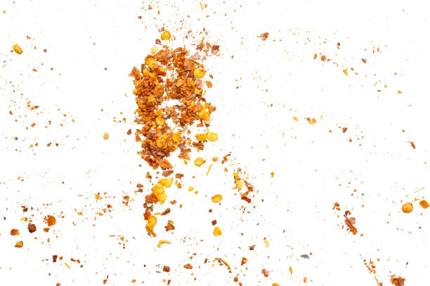 istock dried red chili pepper flakes and seeds isolated on white background 2161399340
