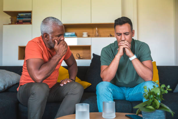 istock Multiracial Men Sharing Personal Struggles in Living Room 2161401724