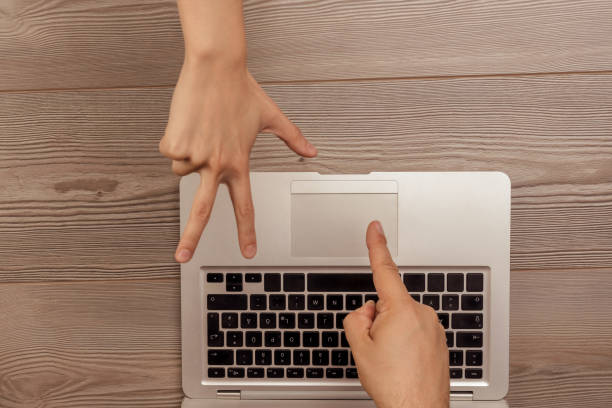 istock Hands playing morra above laptop, online gambling 2161403429