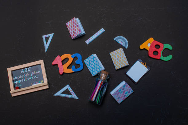 istock School supplies on black background. Back to school 2161404735